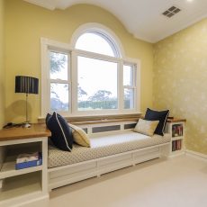 Charming country window seat with book shelves