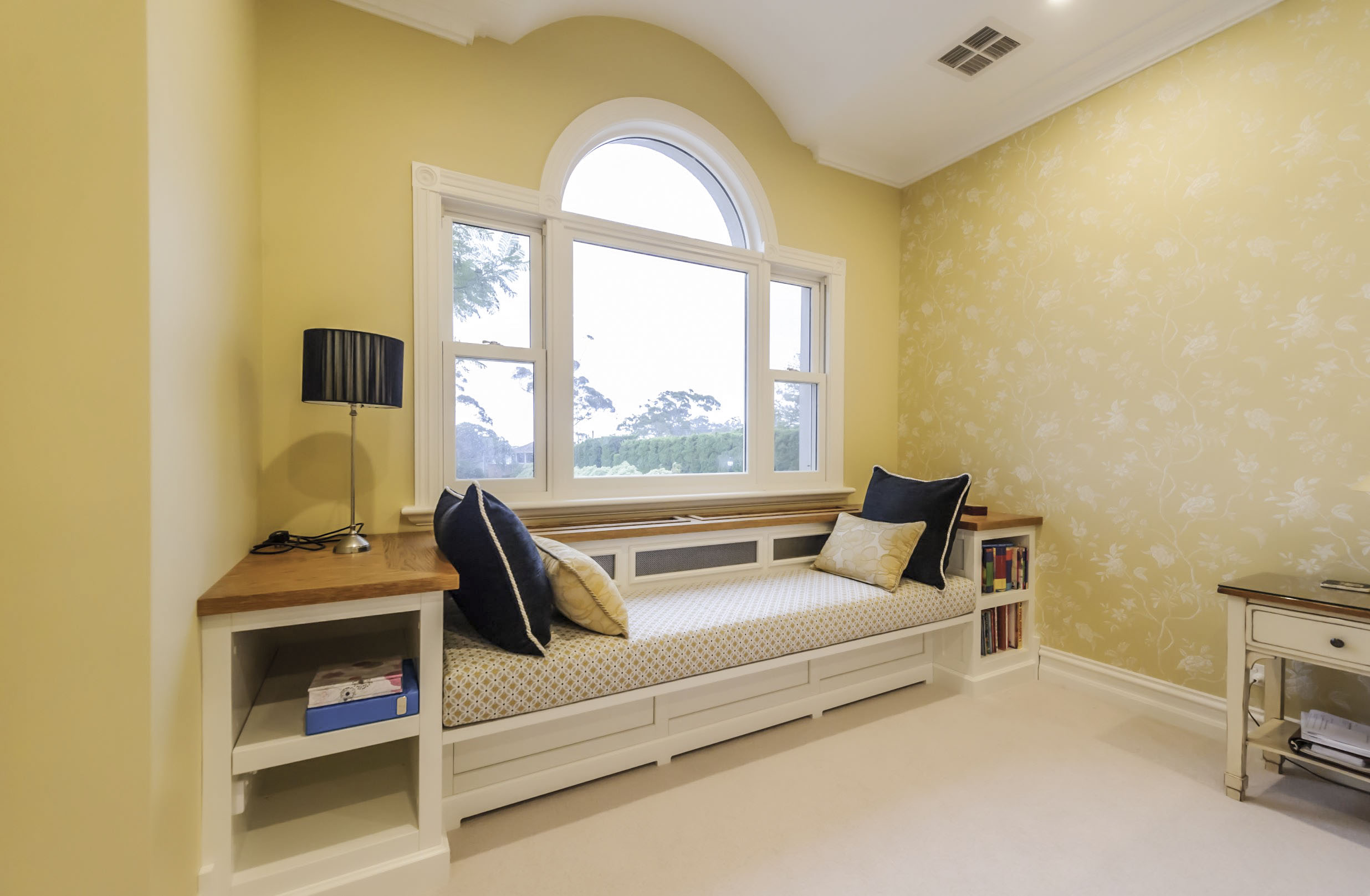 Charming country window seat with book shelves
